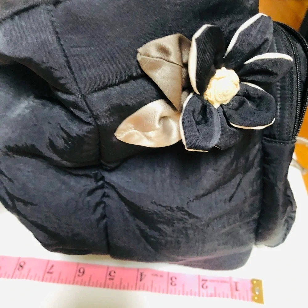 Arisha black super cute microfiber like fabric bag w/ attached flower detail